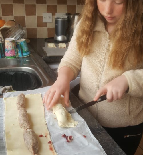 Child cutting a cake